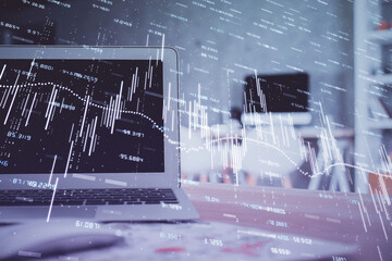 Forex market chart hologram and personal computer background. Double exposure. Concept of investment.