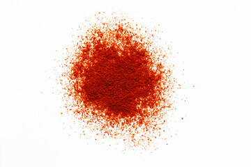 Pile of red paprika powder flat lay on whire background