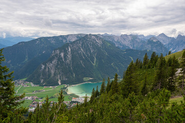 Fototapeta na wymiar Achensee, Austria in it's beauty surrounded with mountains and cloud