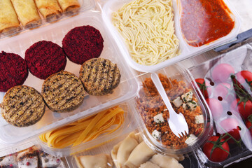 A variety of prepackaged food products in plastic boxes