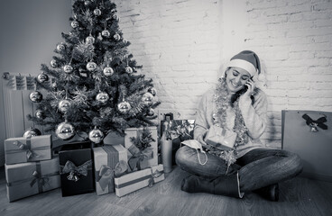 Obraz premium Happy woman video calling family on smart phone celebrating Virtual christmas online at home alone