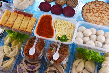 A variety of prepackaged food products in plastic boxes