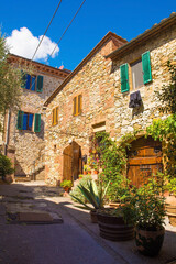 Fototapeta na wymiar Residential buildings in the historic medieval village of Vescovado di Murlo in Siena Province, Tuscany, Italy 