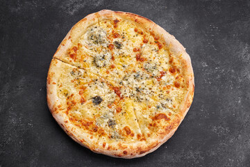 4 cheese pizza on a dark background