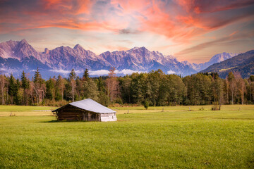 Little shed in front of the alps