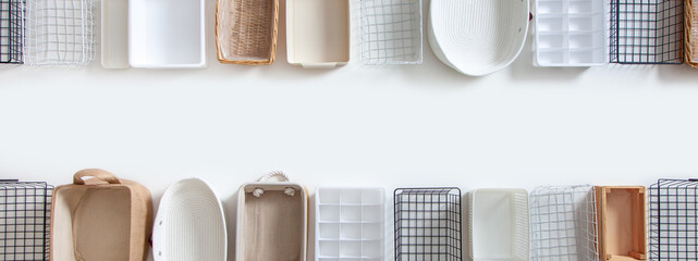 Top view of closet organization boxes and steel wire baskets in different shapes.