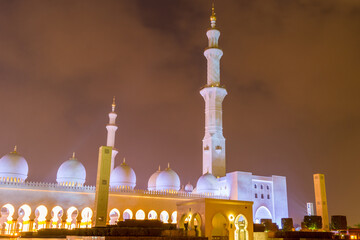 Night view of Grand Mosque, also called Sheikh Zayed Grand Mosque in Abu Dhabi, United Arab Emirates, a very popular touristic site.