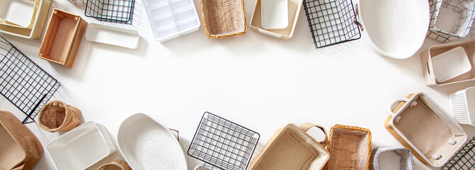 Top view of closet organization boxes and steel wire baskets in different shapes.