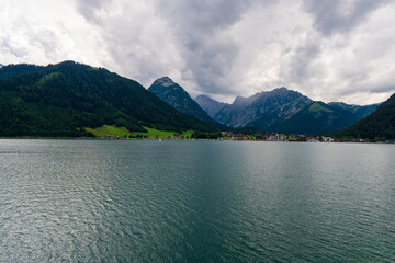 Fototapeta na wymiar Cystal clear water of Achensee lake near Pertisau town on sunny summer day, Tirol, Austria