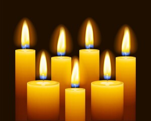Set of three burning candles on dark background