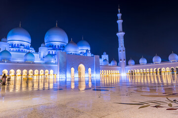 Night view of Grand Mosque, also called Sheikh Zayed Grand Mosque in Abu Dhabi, United Arab Emirates, a very popular touristic site.