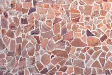 Brown stone wall of the old building.
