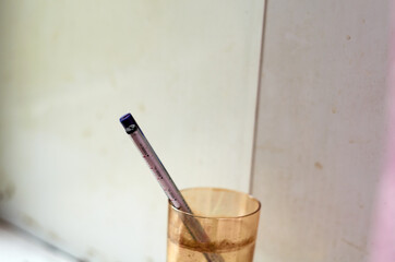 Two refills for gel pens in a glass