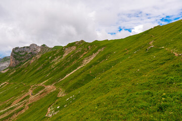 Fototapeta premium summer mountains green grass and blue sky landscape near achensee in austria, europe alps in cloudy day