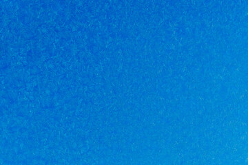 blue  frost on a glass background. texture patterned frosted glass.