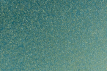 blue frost on a glass background. texture patterned frosted glass.