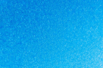 blue  frost on a glass background. texture patterned frosted glass.