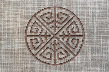 Ornamental print on the surface of the fabric. Pattern on linen fabric. Close-up seamless texture. Rough gray fabric surface. Linen fabric texture. Wallpaper. Tile