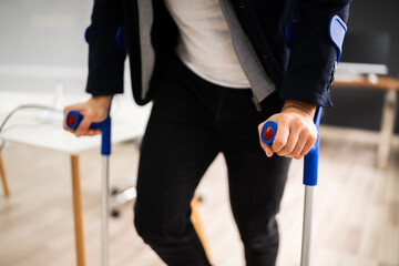 Disabled Man Standing With Crutches