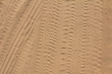 traces of wheel protectors on a dirt road