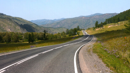 Road to the mountains in Altai, Russia. Consept of traveling, way, road trip
