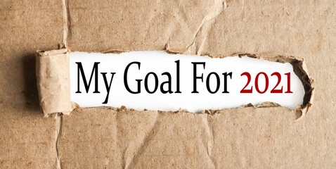 my goal for 2021, text on white paper on torn paper background.