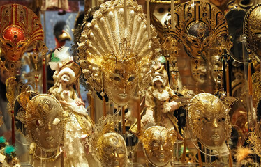 Golden face mask with sculptures