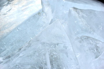 Obraz premium Blue blocks of ice close up with bubbles and cracks
