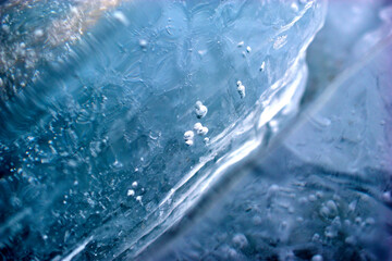 Obraz na płótnie Canvas Blue blocks of ice close up with bubbles and cracks