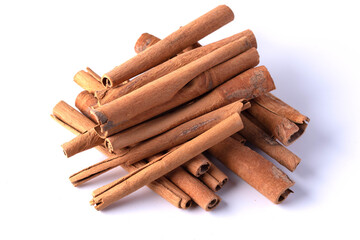 A pile of cinnamon on a white background