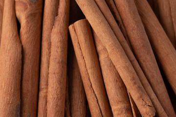 A pile of cinnamon on a white background