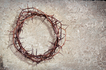 A crown of thorns on a stone texture background