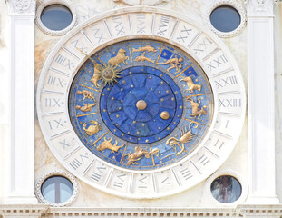 Beautiful sundial with a golden sun in Venice