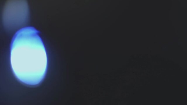 Flickering blue light highlights on a black background HD