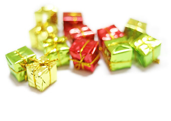 top view of arranged wrapped christmas gift boxes with ribbons on white background