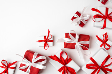 Red and white gift boxes on white background. top view. Valentine's day. Merry Christmas and Happy New Year