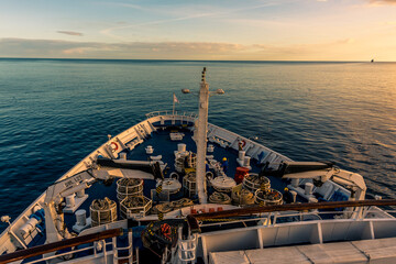 Sailing away from the city of Funchal, Madeira into the sunset