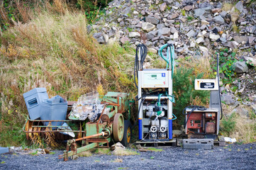 Derelict redundant diesel oil pumps at scrap yard