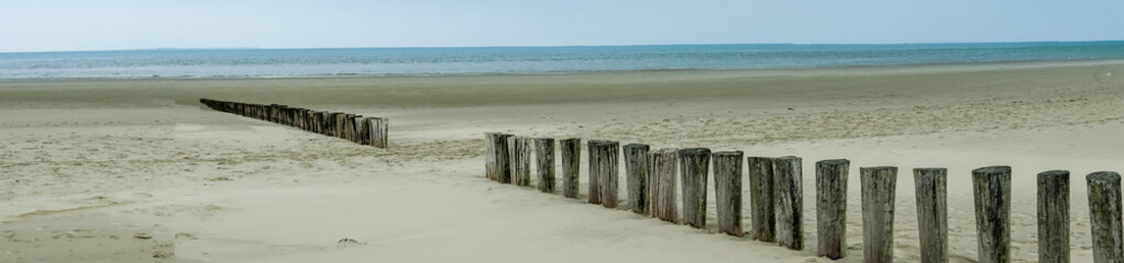 Panoramic view of wooden breakwater along the Dutch coast of Ameland