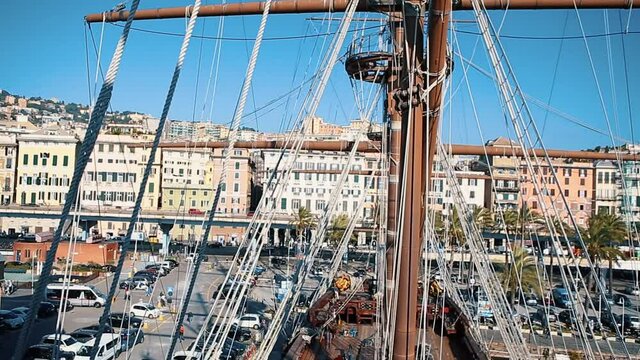 Panoramic video clip of ancient wooden pirate shit tied on pier at Old City Port marina in Genova,Italy.Popular touris attraction in Liguria,Italia.European travel destination for cultural tourism