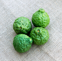 Bergamot fruit material of essential oils for beauty and cooking food ingredient healthy, it is on the sackcloth background.