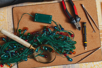 New Years is soon. Repair of Christmas tree electric garland