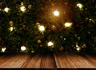 Background of Wood table top on Christmas tree at night for New Year 2020 and Merry Christmas