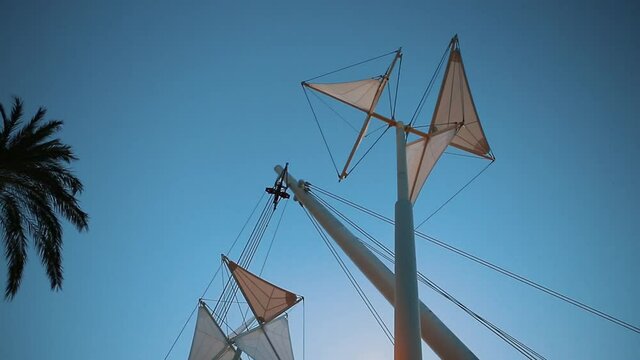 Wind catcher in Old City Port marina of Genova,Italy.Bigo installation and poles with windcatches installed in harbor of Ligurian sea in Genoa,Italia