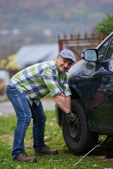 Man changing a flat tyre
