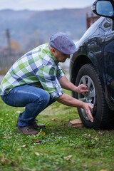 Man changing a flat tyre