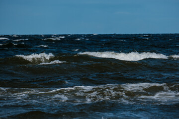 sea beach with white sand and blue water before storm