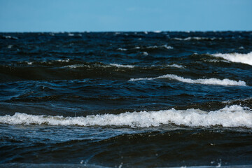 sea beach with white sand and blue water before storm