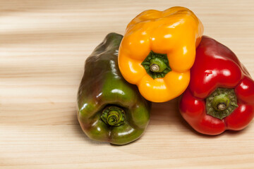 Capsicum annuum - Healthy food; three colored sweet peppers: red, yellow, and green.