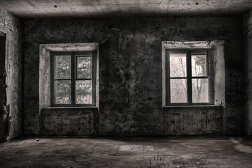 Two symmetrical windows in a scary and terrible room in an old abandoned building. Dirty and rusty...